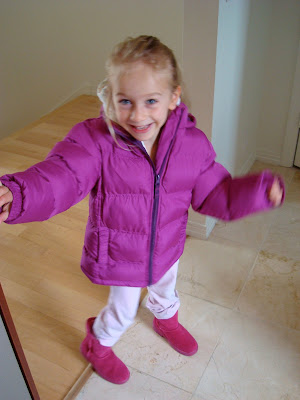 Young girl dancing in new jacket and boots
