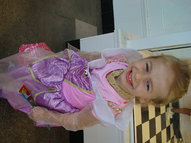Young girl standing in costume smiling