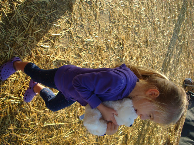 Young girl hugging stuffed animal