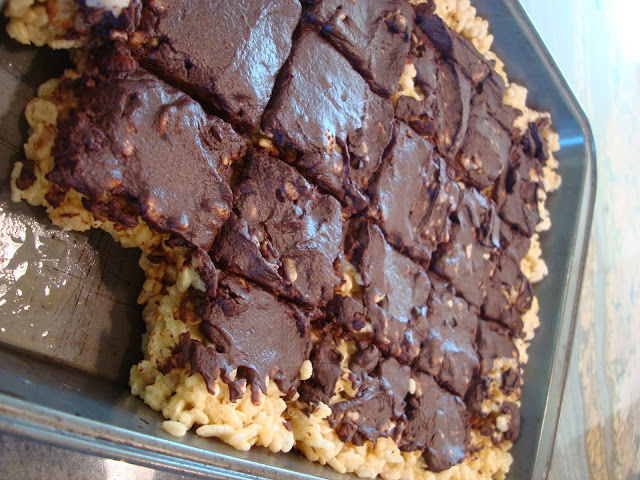 Vegan Gluten Free Rice Krispie Treats with Chocolate Frosting in pan with bars missing
