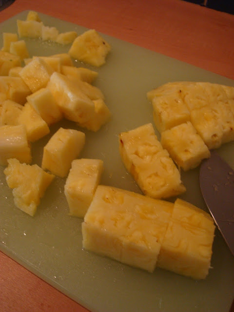 Diced up pineapple on cutting board