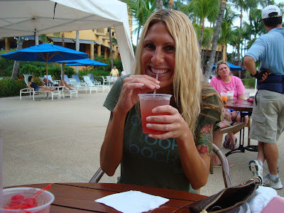 Woman at outdoor patio table drinking Sex on the Beach Cocktail