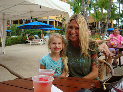 Woman and young girl sitting at table at outdoor patio smiling - 15