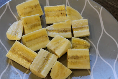 Sliced up bananas on plate