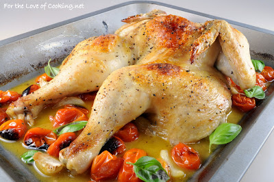 spatchcocked roasted chicken with tomatoes, garlic, and fresh basil