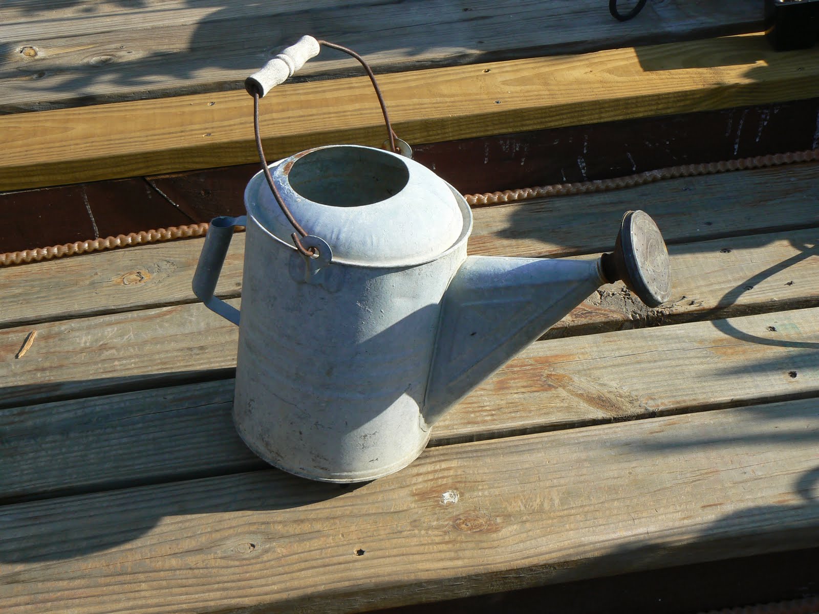 A Pretty Pastime Sunflowers and Watering Cans