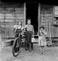 Three of the four [actually all four, plus cat] Arnold children. The oldest boy earned the money to buy his bicycle. Western Washington, Thurston County, Michigan Hill.