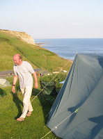 Mr A and our tent with the sea in the background