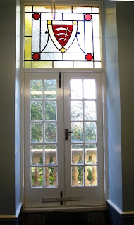French door with stained glass panel of the Essex coat of arms