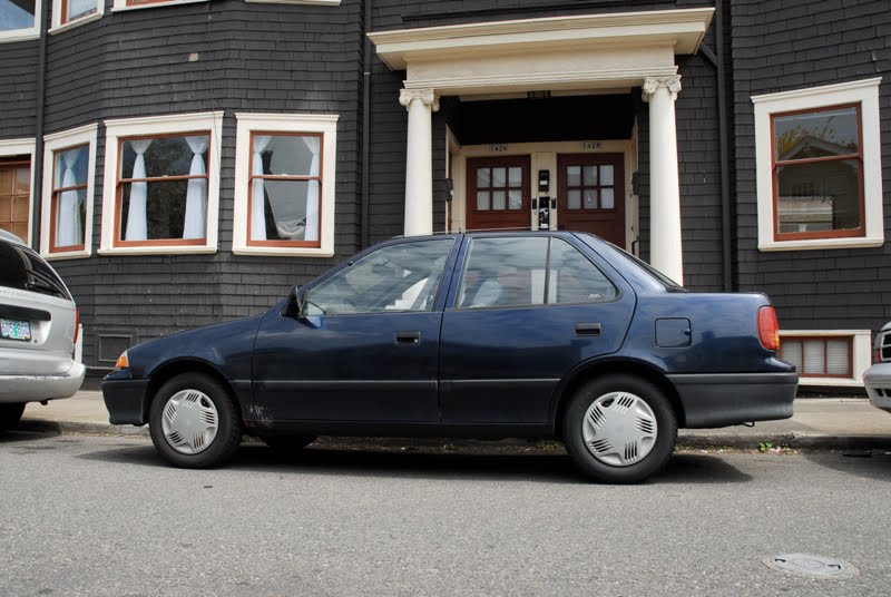 OLD PARKED CARS.: 1992 Suzuki Swift.