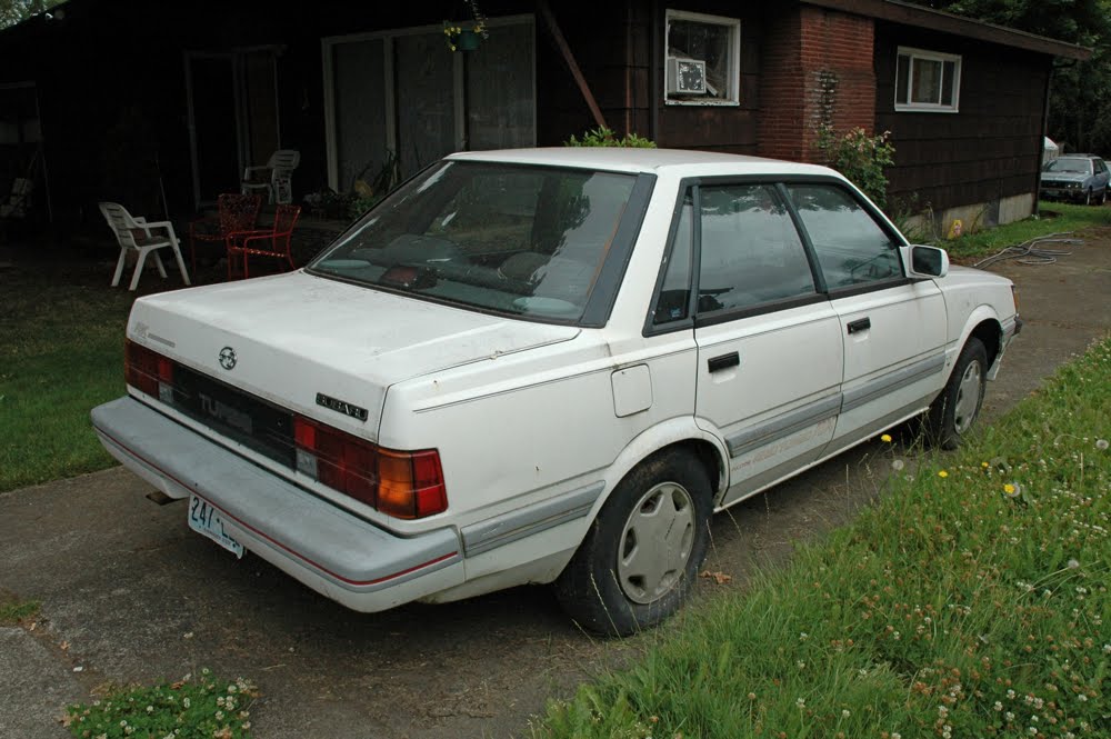 OLD PARKED CARS.: 1988 Subaru RX.