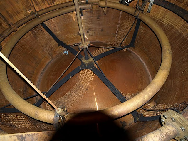inside a still at Springbank Distillery showing the rummager and steam heating pipes
