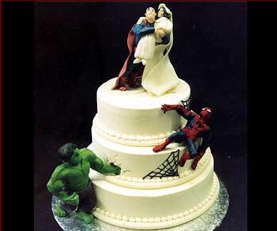 cake where spiderman & hulk are climbing on it