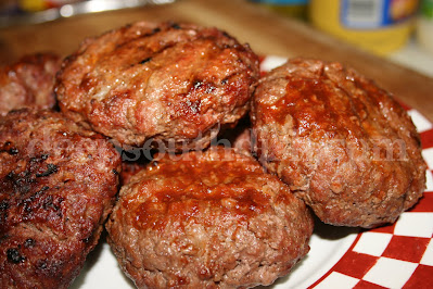 Burgers stuffed with Pepper Jack cheese and flavored with an all-purpose sauce like Country Bob's.