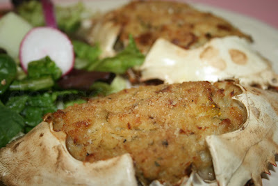 Stuffed crab, made with fresh lump crabmeat, onion, and bell pepper, seasoned with Old Bay and Cajun seasoning and bound with egg and toasted bread crumbs and baked.