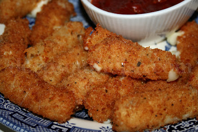 A combination of seasoned dry bread crumbs and panko make for some yummy fried cheese sticks! Try them with a super easy homemade marinara sauce.