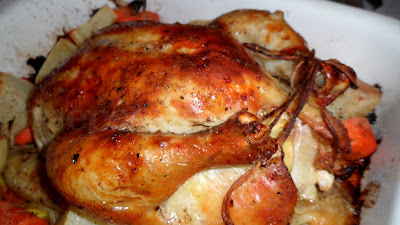 A basic garlic and lemon roasted chicken with root vegetables cooked alongside.