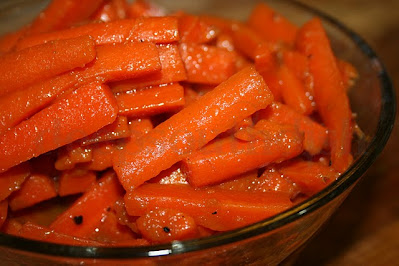 Carottes Glacées - a savory glazed carrot side dish, made from strips of carrots, slow boiled in beef stock with a little sugar and plenty of butter.
