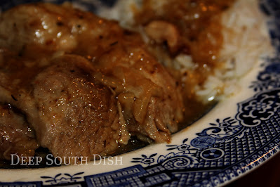 ransform a pork shoulder into this simple but amazingly delicious dish with a quick sear, simple seasonings, lightly caramelized onions and a simple roux. Fantastic.