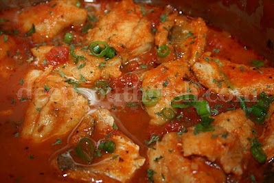 A Deep South Courtbouillon is a roux-based fish stew, made with creole tomato sauce, stewed down and reduced, and used to poach fish - often redfish, red snapper or catfish.