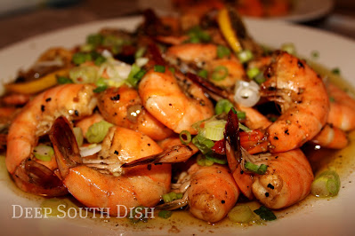 New Orleans style barbecue shrimp, made with large shrimp, Creole seasoning, beer, hot sauce, olive oil, lots of Worcestershire sauce and pepper, and a sinful amount of butter.