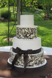 4-tier round buttercream and marbled chocolate
