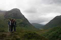 Moss covered peaks of Glencoe in the backgroud, family in the foreground