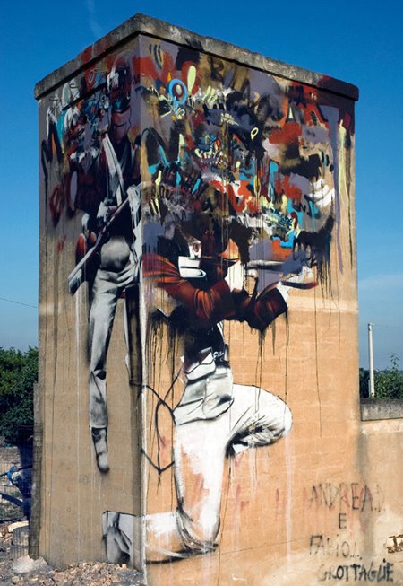 Irish artist Conor Harrington paints a mural in Southern Italy