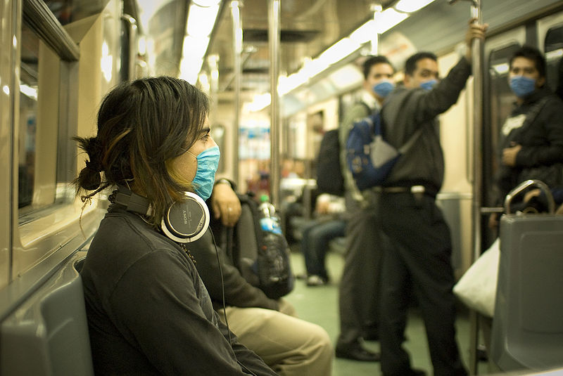 [800px-Swine_Flu_Masked_Train_Passengers_in_Mexico_City.jpg]