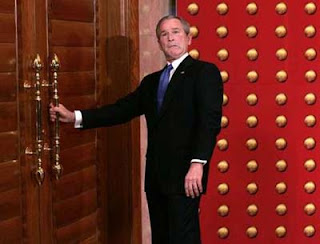 George Bush tries to open A door