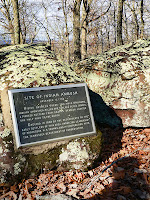 Indian Rock commemorative plaque on Indian Rock Trail in Big Ridge State Park.