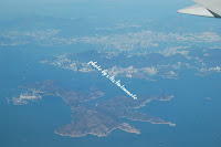 手前から南Ｙ島（Lamma Island）、香港島（Hong Kong Island）、九龍（Kowloon）左上部に大帽山（Tai Mo Shan）