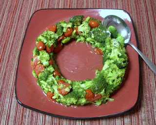 Broccoli and grape tomatoes shaped into a festive wreath by a ring mold