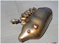 golden pig statue and 11 piglets