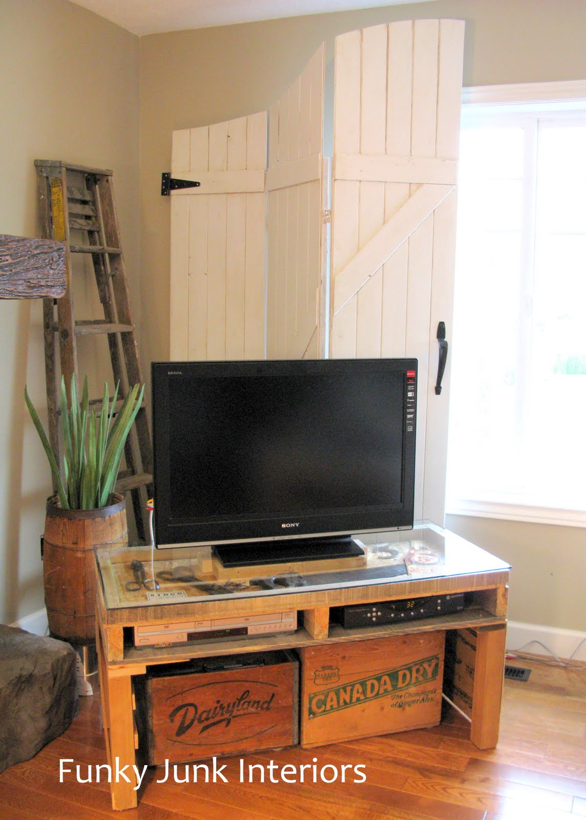 new TV stand made from a palletFunky Junk Interiors