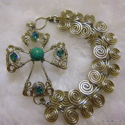 wire wrapped bracelet wire wrapped swirly cross with egyptian coil bracelet - 8mm turquoise focal