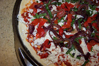 Unbaked caramelized onion pizza. 