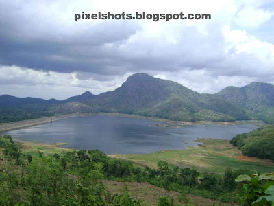 river dam reservoir photograph from small irrigation dam hydro dam project in kerala,dam named poothundi in palakkad district of indian state kerala