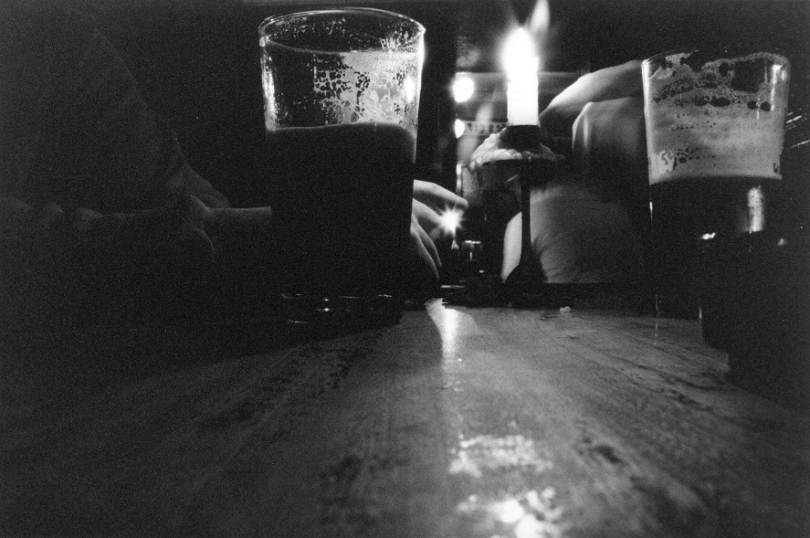 [beer-stout-glasses-and-candle-on-wood-table-in-London-pub-mono-1-DHD.jpg]