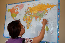 a delegate leaves a 'spot' on the world map indicating where she is from