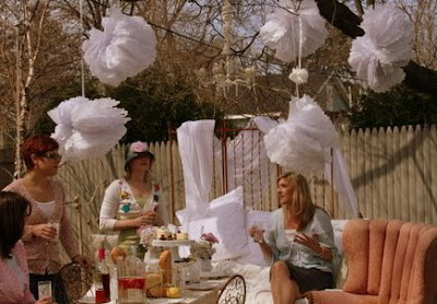 Girls sitting outside at a party