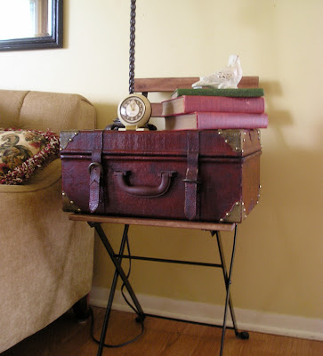 A quick and easy side table with a vintage chair and suitcase