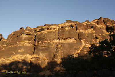 Rocky hillock at Dhoopgarh getting highlighted by sunset