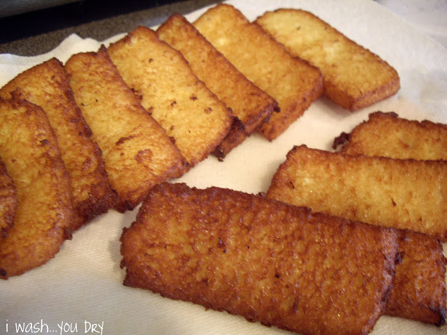 Fried French toast slices on a a paper towel. 