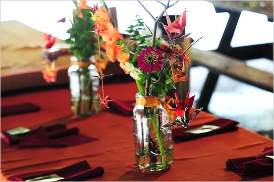 Reclaimed glass mason jars provide the perfect foundation for centerpieces