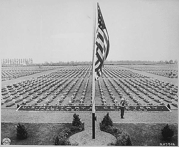 A bugler blows taps at the close of Memorial Day service at Margraten Cemetery, Holland