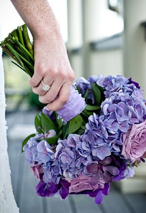 Gorgeous purple themed bridal bouquet with long stems