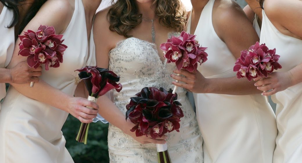 Plum orchids bridesmaid bouquets Burgundy calla lilies surrounded by red 