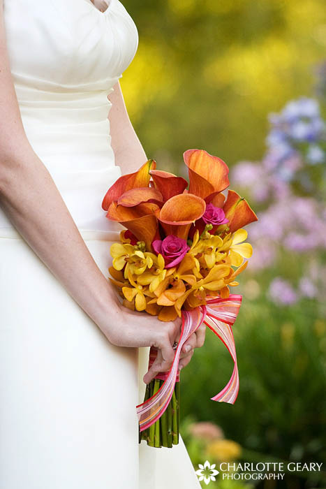 Mango calla lily bridal bouquet with yellow orchids