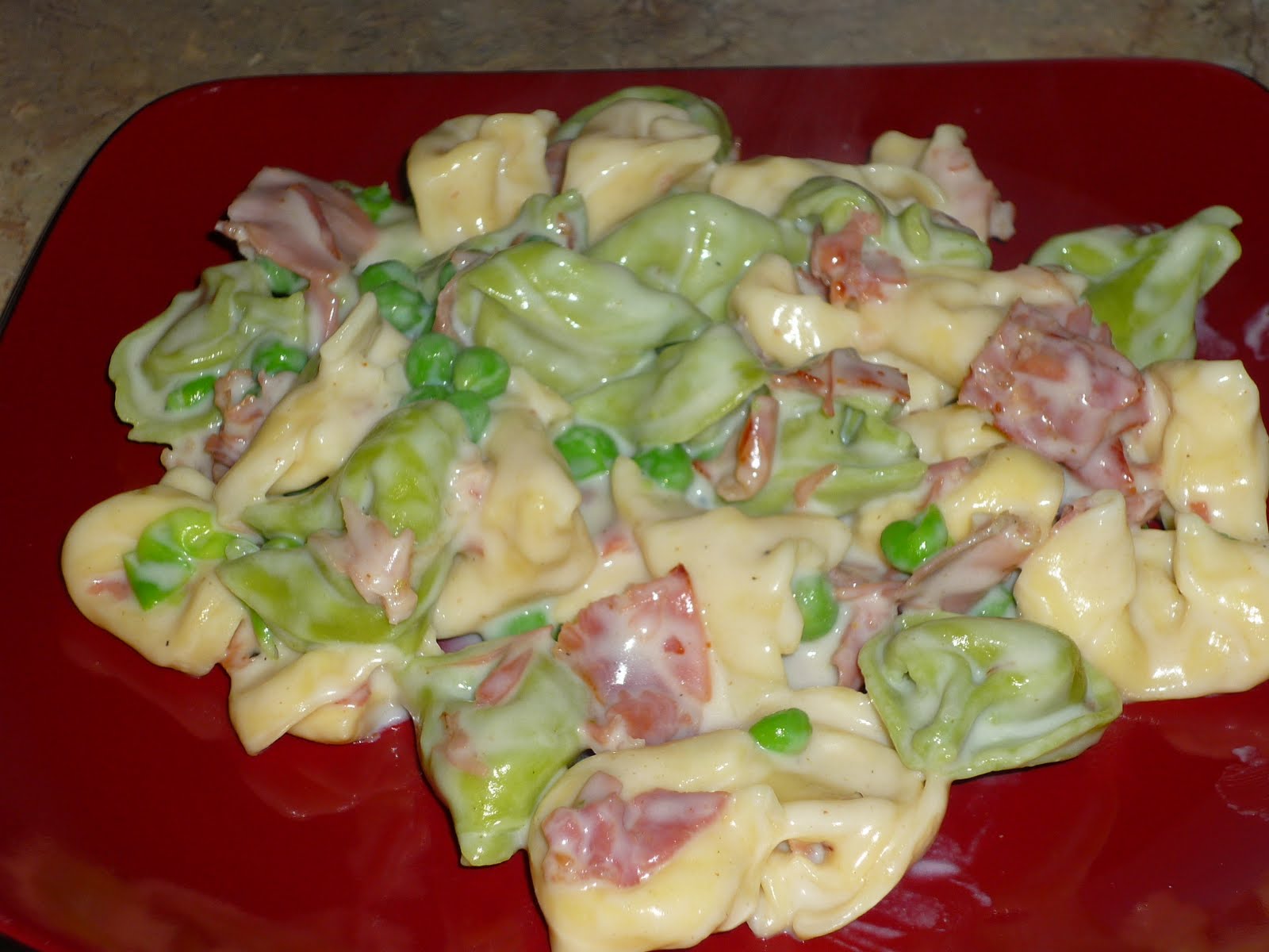 The Iowa Housewife Tortellini with Prosciutto and Peas in a Creamy Sauce